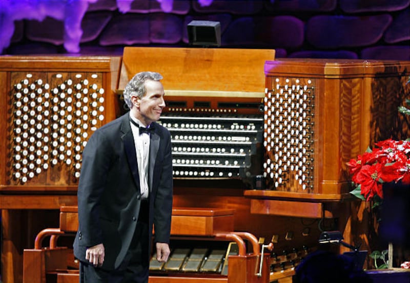 Organist Richard Elliott acknowledges a standing ovation for his rendition of "Good King Wenceslas" at the Conference Center in Salt Lake City on Dec. 11, 2009.
