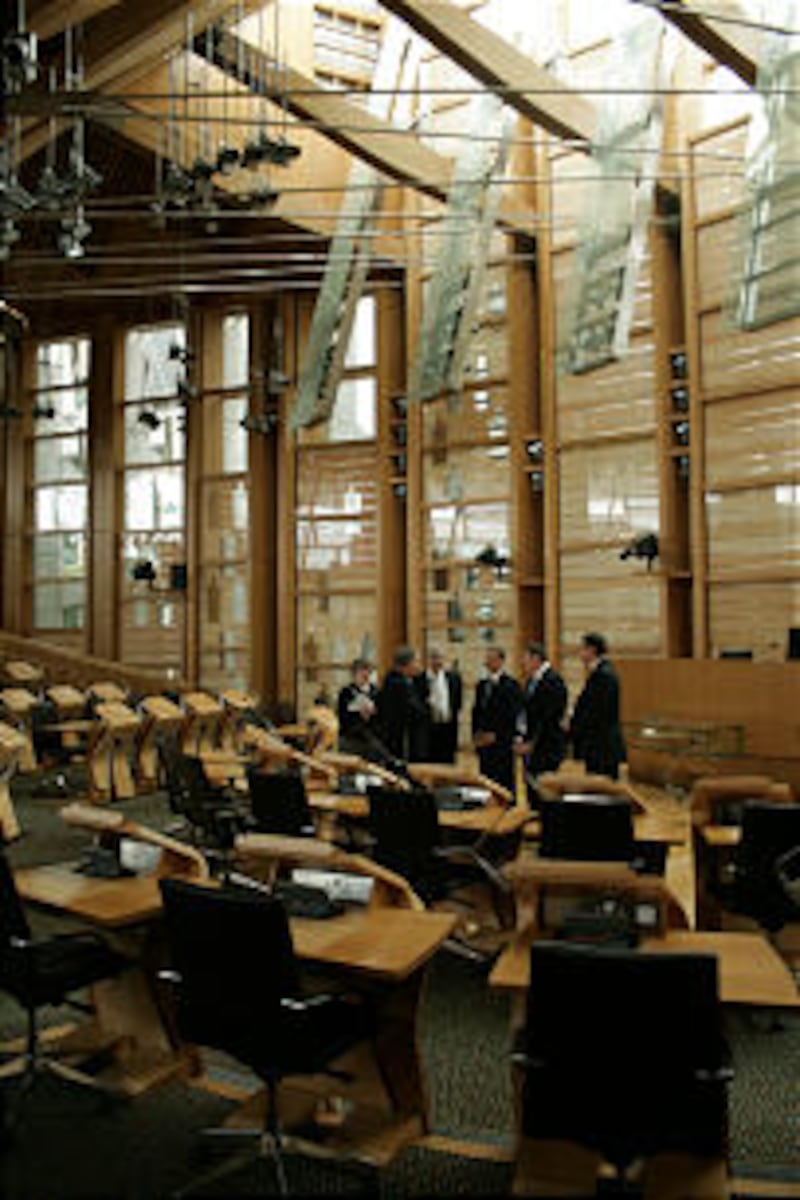 LDS and Scottish leaders chat on floor of Scottish Parliament at the Holyrood Building, where minist