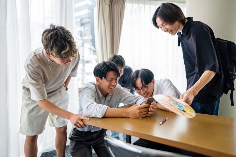 Japanese young adults talk together.