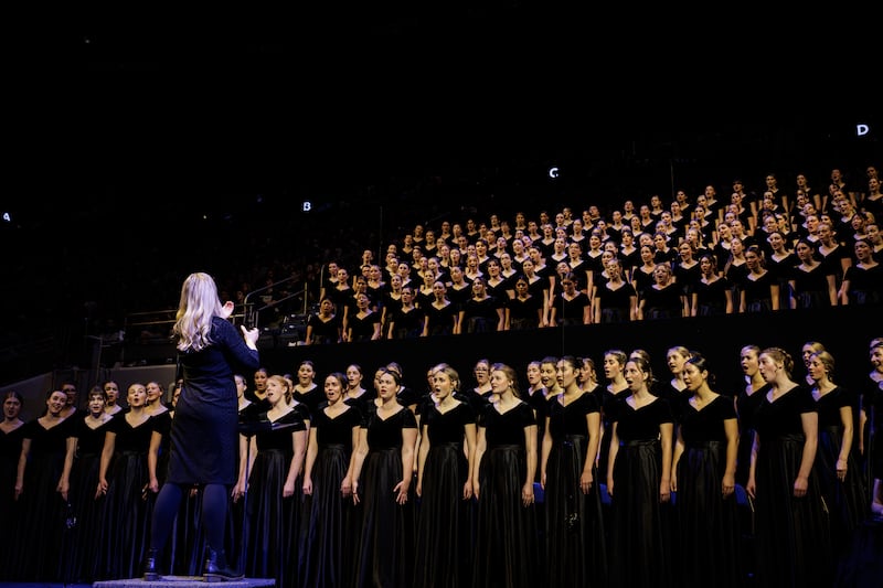 The BYU Women's Choir performs during a devotional with Elder Ronald A. Rasband of the Quorum of the Twelve Apostles in the Marriott Center in Provo, Utah, on Tuesday, Oct. 27, 2026.