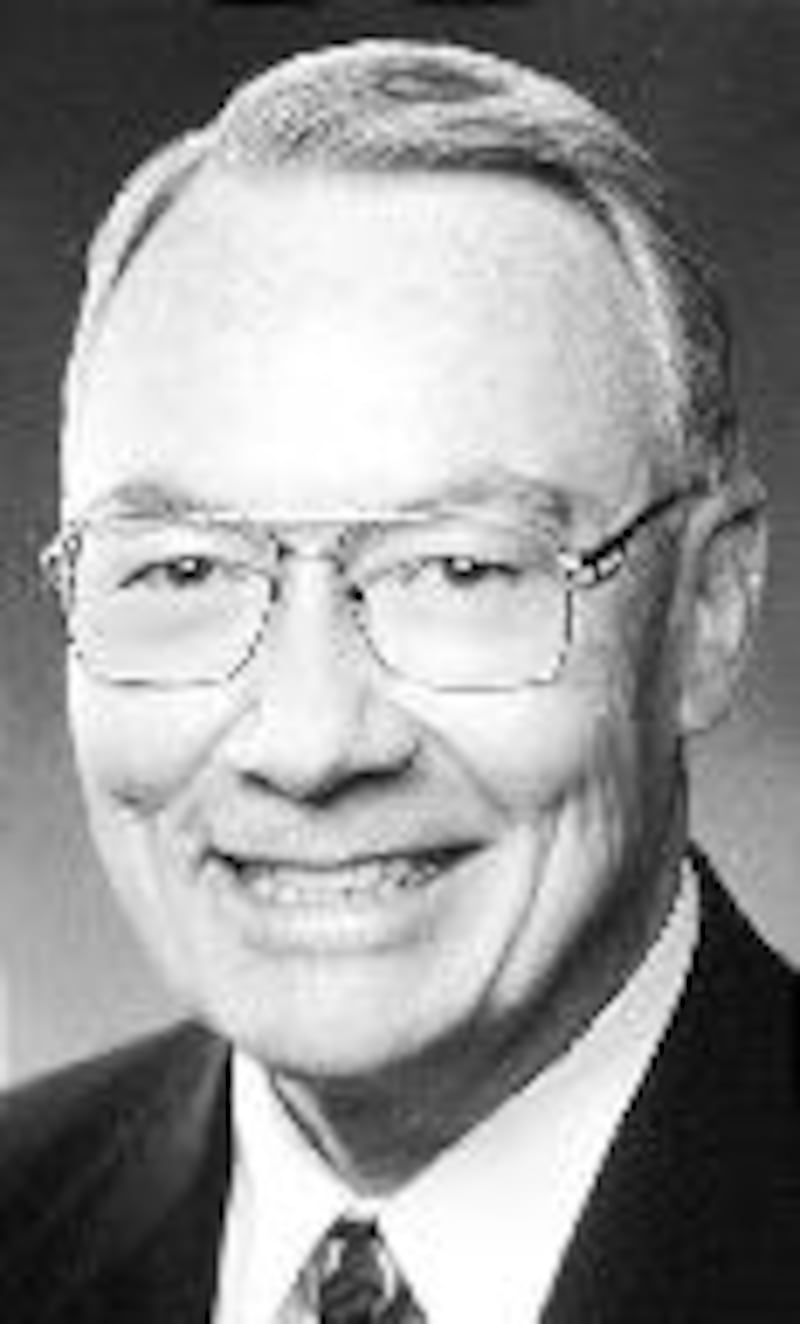 Dennis E. Simmons