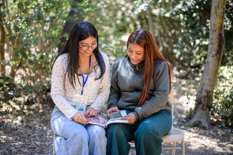 Two young women study during a For the Strength of Youth conference in Chile on Feb. 10, 2026.