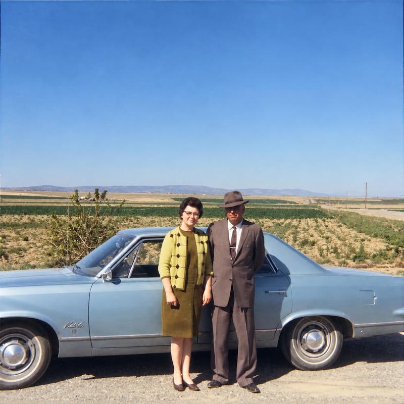 Evan and Alta Beus take a picture in front of their new farm in Othello, Washington, around 1958.