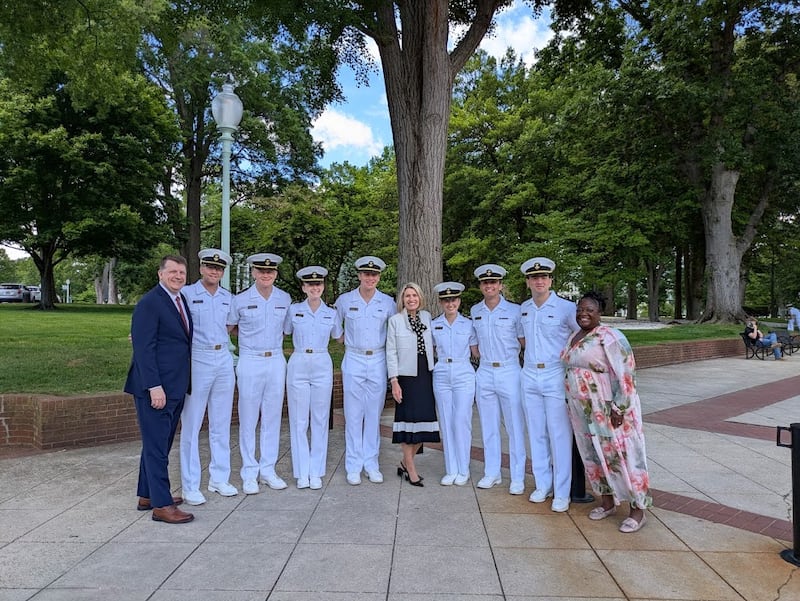 President Camille N. Johnson, Elder Michael P. Brady and Sister Eme Martin take a picture with seven Latter-day Saints who are current midshipmen at the United States Naval Academy in Annapolis, Maryland, on Friday, May 15, 2026.