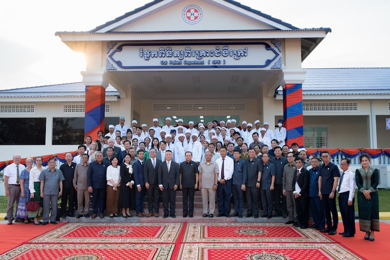 Healthcare workers, government officials and leaders of The Church of Jesus Christ of Latter-day Saints gather in front of the new outpatient building in the Preah Net Preah Referral Hospital complex in the Banteay Meanchey province in northwestern Cambodia on Feb. 26, 2026.