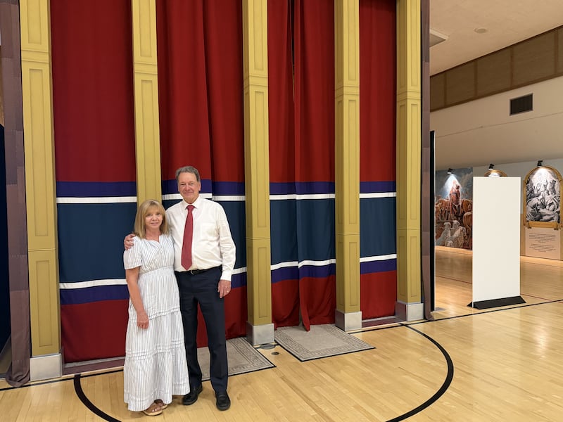 David and Eulale Dixon stand in front of the Old Testament Tabernacle replica they helped bring to life in the Farmington Utah North stake center, June 18, 2026.