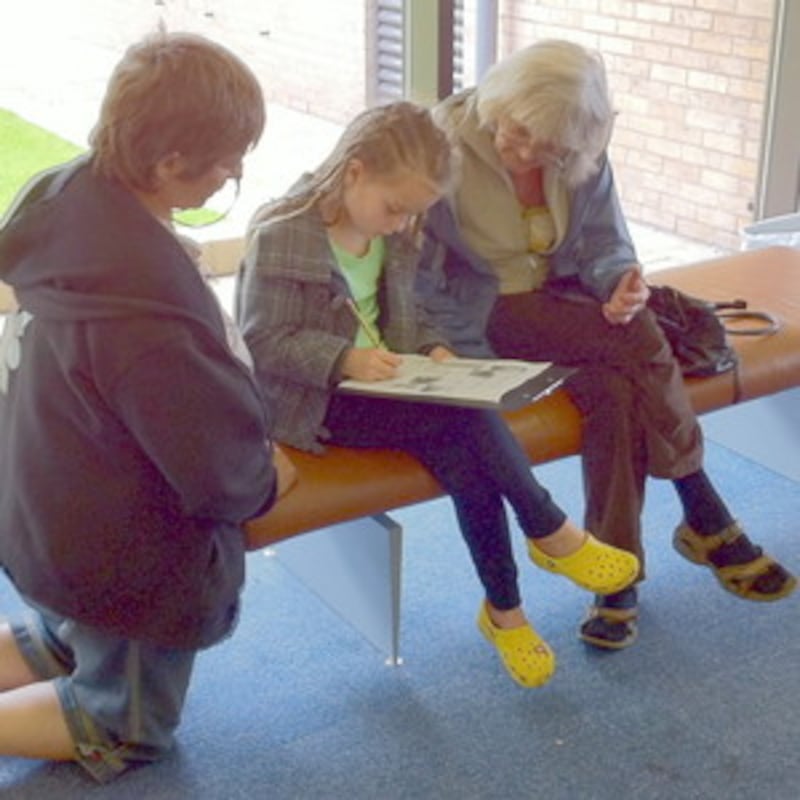 Abby Crompton, center, completes child's questionnaire during a visit to the grounds of the Preston