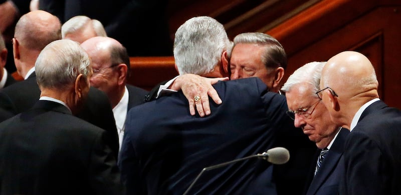 Elder Jeffrey R. Holland hugs President Dieter F. Uchtdorf, back to camera, after the Saturday morning session of the 187th Semiannual General Conference of The Church of Jesus Christ of Latter-day Saints in Salt Lake City on Saturday, Sept. 30, 2017.