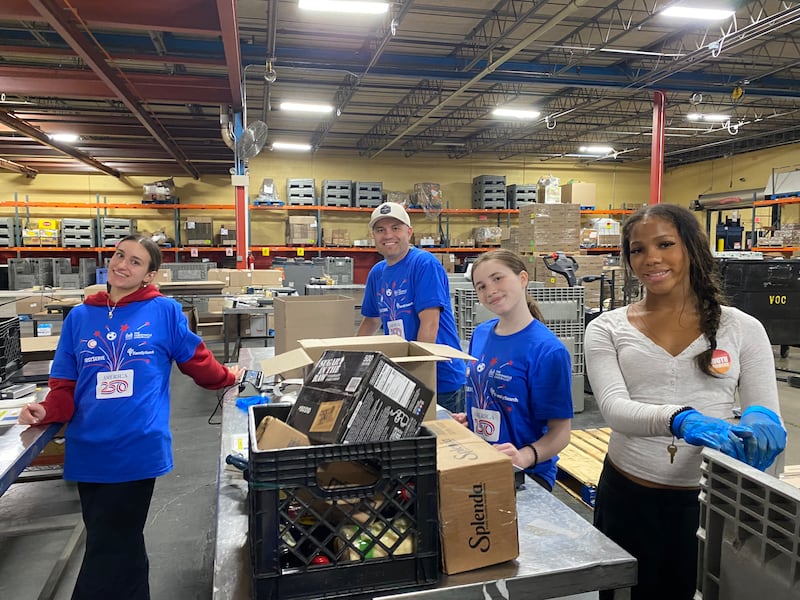 Volunteers help organize food donated by The Church of Jesus Christ of Latter-day Saints to Harvesters Food Bank in Kansas City, Missouri, on Thursday, April 23, 2026.
