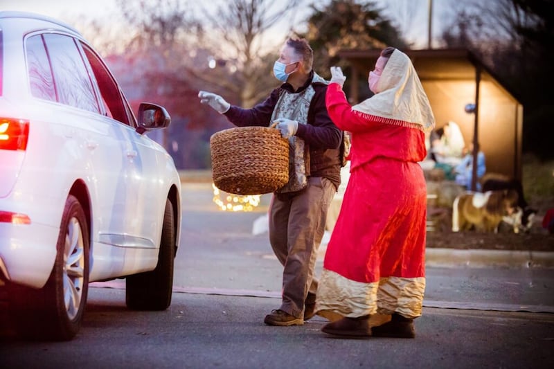 Members of the #LightTheWorld drive-thru Nativity greet visitors in Charlotte, North Carolina, in December 2020.