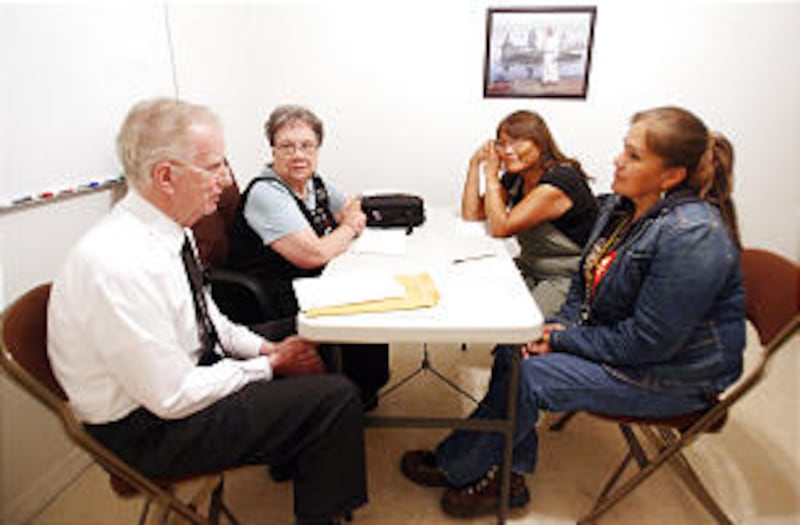 LDS missionaries Frank and Patricia Jasper (L) teach a temple preparation course to Earlene Tahbo an