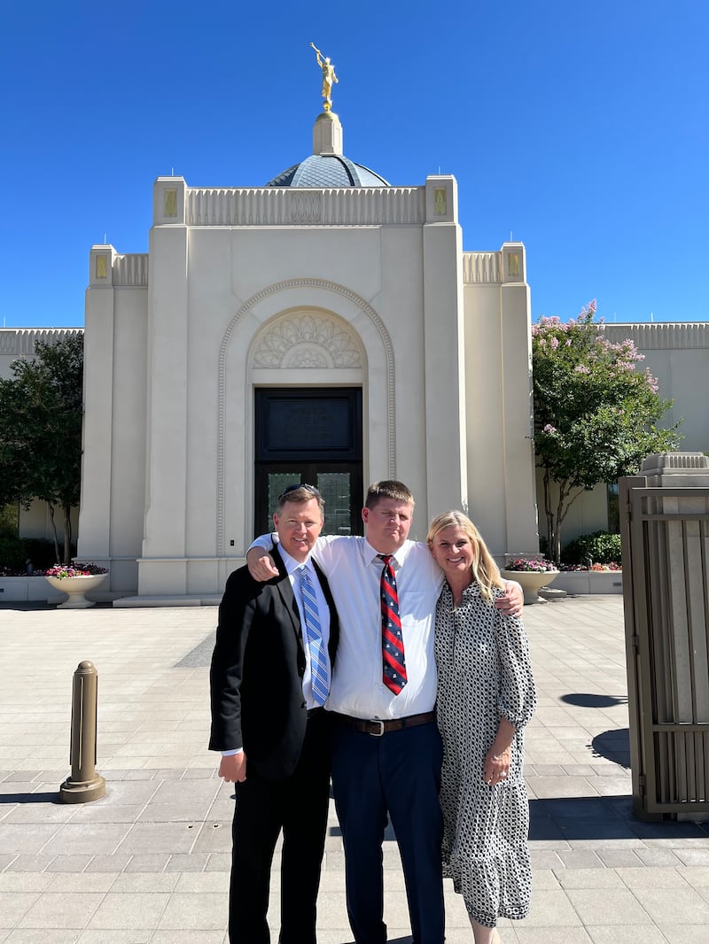 Elder Ashton Curtis, center, poses for a photo in front of the Tucson Arizona Temple with his parents, Helen and Judd Curtis, April 2025.