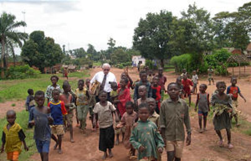 Elder Farrell Barlow walks with the children in Luputa, DR Congo, where the Church is undertaking th