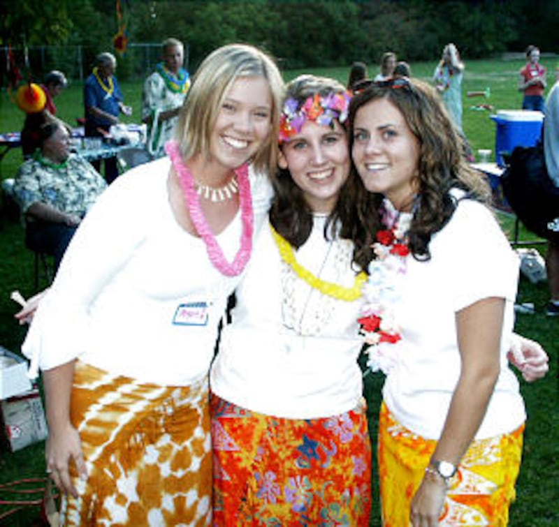 During a Salt Lake City institute cookout, students Angie Lee, left, Stephanie Michaelis and Rebecc