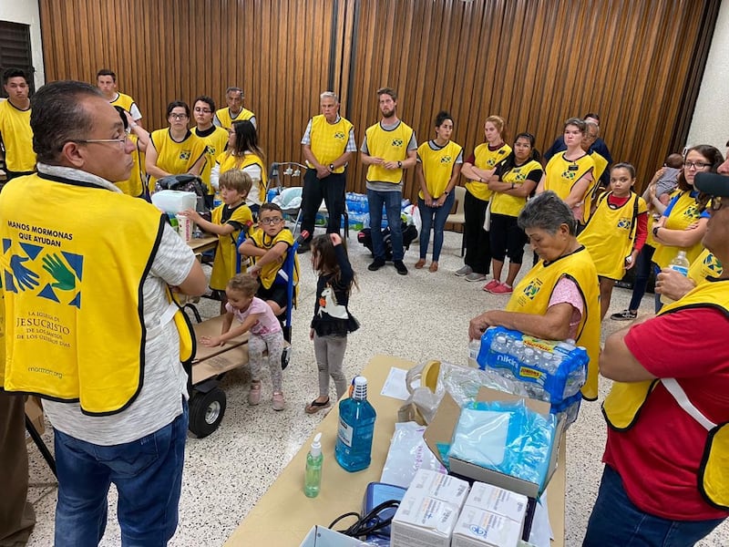 Missionaries and members of all ages gather at a meetinghouse in Ponce, Puerto Rico, to take part in a humanitarian project designed to bring relief to people on the Caribbean island affected by several earthquakes in 2020.