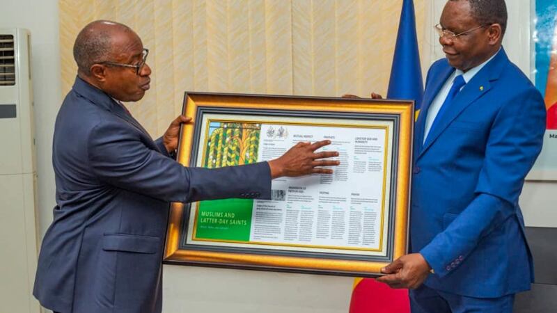 Elder Alfred Kyungu presents Allamaye Halina, Prime Minister of Chad, with a gift highlighting common ground between the Church and Islam on Oct. 28, 2025.