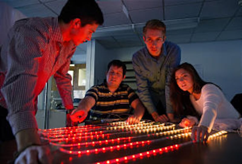Students from the engineering department at BYU work together to create the LED lighting to go in th