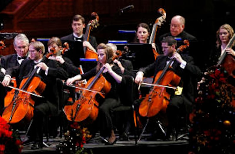 Members of the Orchestra at Temple Square perform during the First Presidency's Christmas Devotional