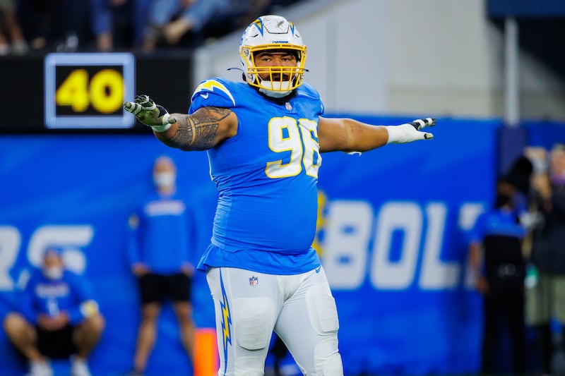 Los Angeles Chargers defensive lineman Breiden Fehoko raises his arms during a game against Pittsburgh.