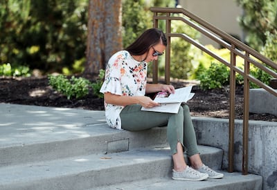 Meagan Harrison of Orem consults her class guide during BYU Education Week in Provo on Tuesday, Aug. 21, 2018.