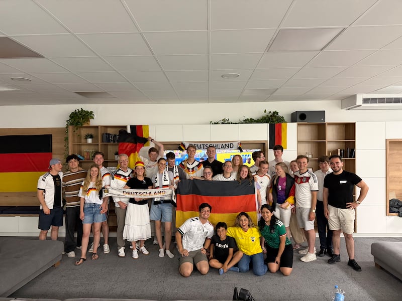 Young adults meet at the Frankfurt Institute of Religion in Frankfurt, Germany, to watch Germany play in the World Cup in June 2026.