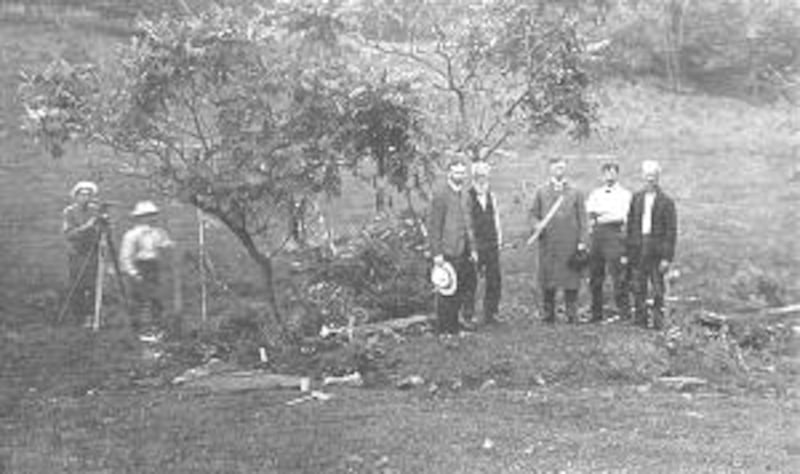 Junius F. Wells, with scroll, stands on Smith home site.