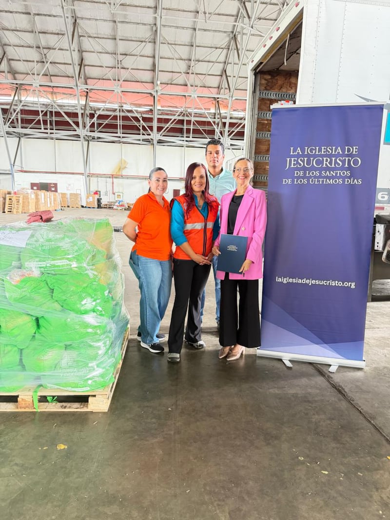 Members of The Church of Jesus Christ of Latter-day Saints pose for a photo next to emergency aid kits donated to families in need in Panama City, Panama, on Oct. 15, 2026, after an earthquake struck the country five days prior.