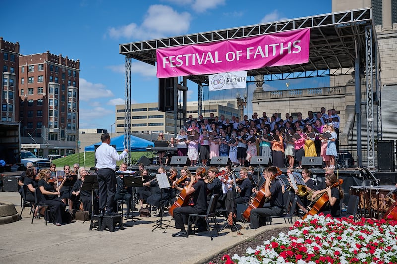A 100-person choir and orchestra from the Church performs on stage at the 11th Annual Indy Festival of Faiths, in Indianapolis.