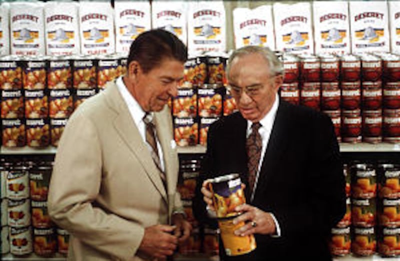President Hinckley, then a counselor in the First Presidency, shows Deseret label to President Ronal