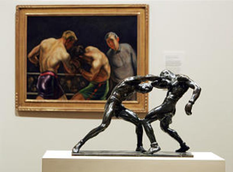 A pair of boxing-themed pieces of art — a painting and a sculpture — were both crafted by LDS ar