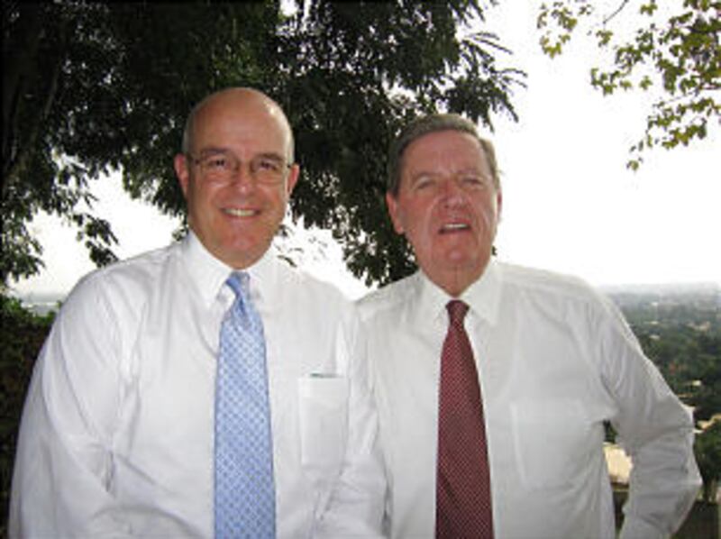 Elder Jeffrey R. Holland and Elder L. Whitney Clayton pause for a moment at the dedication site in