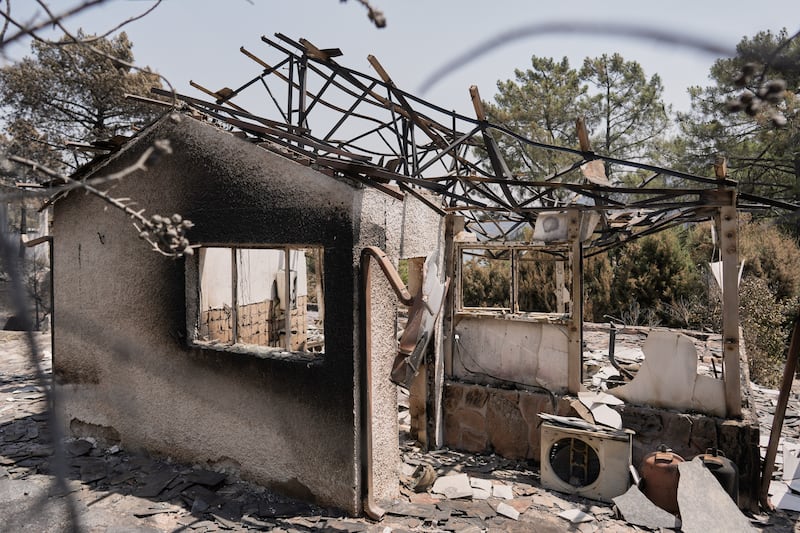 A house destroyed by a wildfire is photographed near Calas del Burguillo, Ávila province, Spain, Wednesday, July 29, 2026.