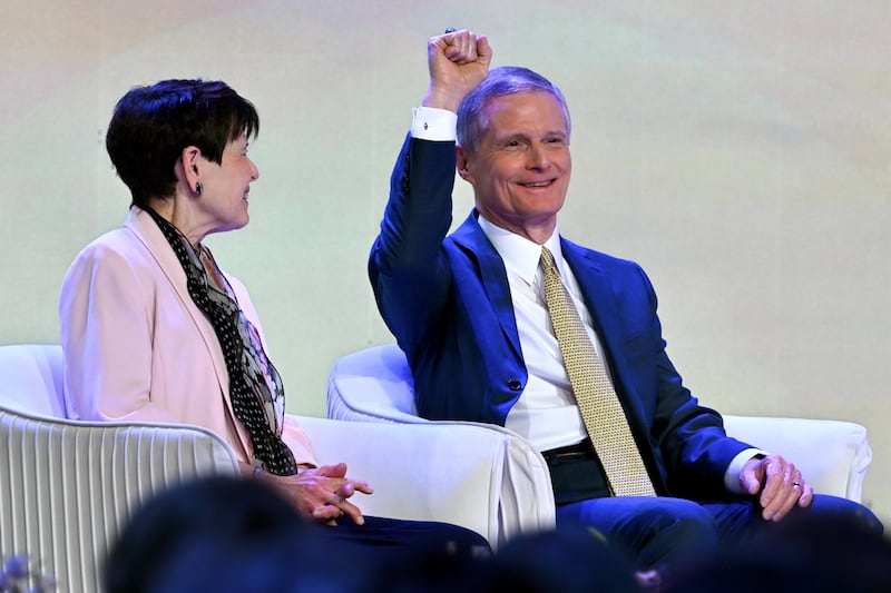 Elder David A. Bednar of the Quorum of the Twelve Apostles waves to an attendee while Sister Susan Bednar observes prior to offering the closing keynote address of BYU Women's Conference in the Marriott Center in Provo, Utah, on Friday, May 1, 2026.