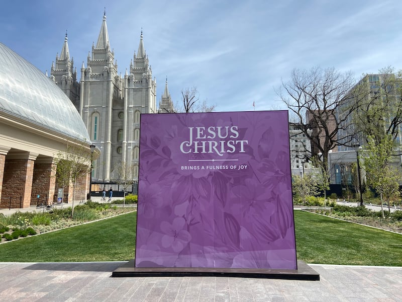 An Easter display declares that "Jesus Christ brings a fulness of joy" south of the Tabernacle on Temple Square in Salt Lake City on Friday, March 27, 2026.