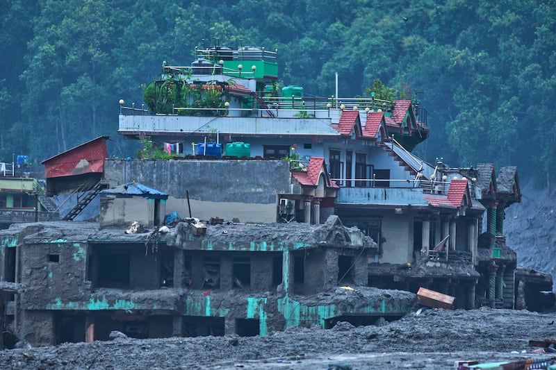 Damage is seen in the aftermath of flash floods in Devighat in the Nuwakot district in Nepal, Thursday, Aug. 27, 2026.