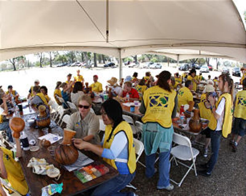 Members of the Irvine California Stake join others from California and Hawaii in service on April 28