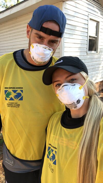 Former BYU athletes Mitch and Madie Mathews donned masks and yellow Helping Hands vests during a recent cleanup project in Wilmington, North Carolina.