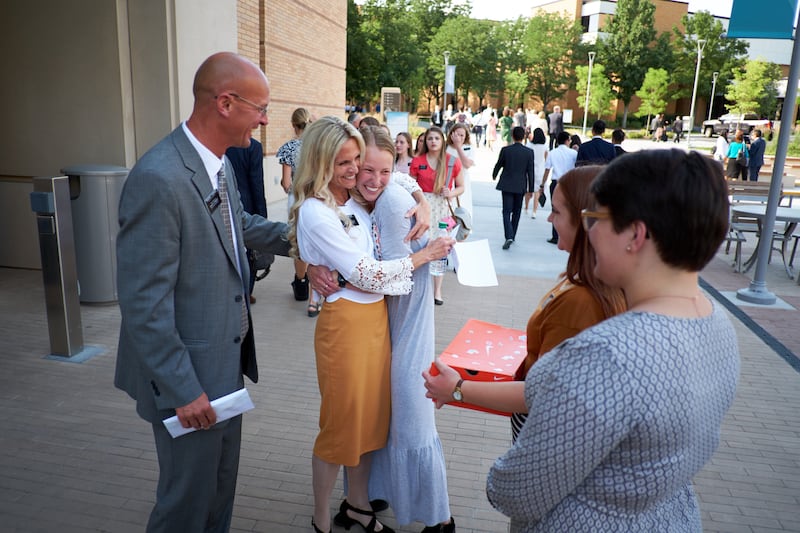 A mission president and his companion greet missionaries at the Provo Missionary Training Center dur