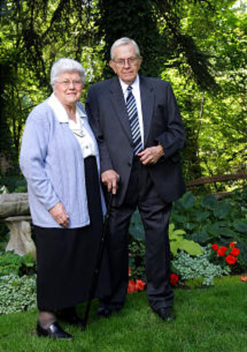President Boyd K. Packer on his 85th birthday. He and his wife, Donna pose in their back yard. Sat