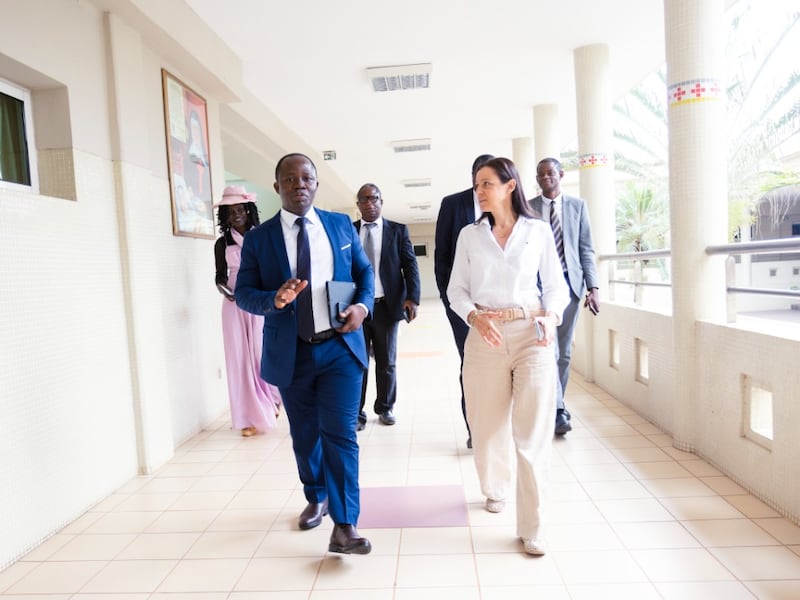 Elder Mathias N. Niambe walks with Ombretta Passoti at St. Giuseppe Moscati Catholic Hospital in Yamoussoukro, Ivory Coast, on March 11, 2026.