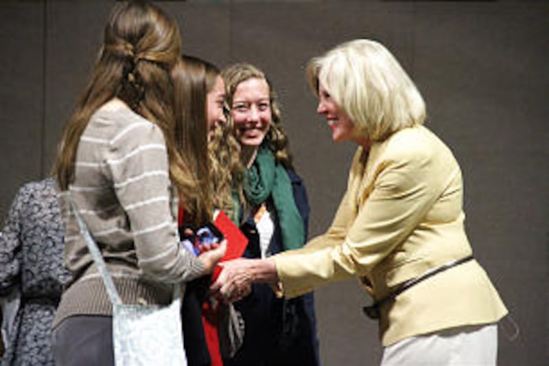 Sister Dalton greets three young women from among the many audience members who approached and conve