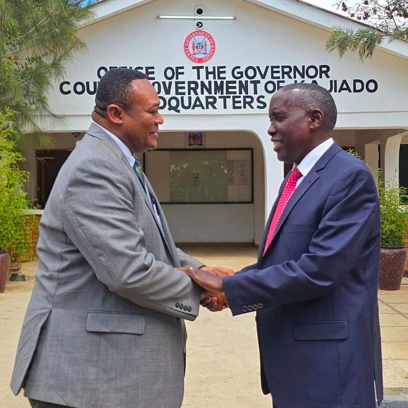 Elder Thierry K. Mutombo, General Authority Seventy and Africa Central Area President shakes hands with Joseph Ole Lenku, Kajiado County governor, in Kenya on July 30, 2025.
