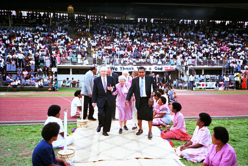 President Gordon B. Hinckley and his wife, Sister Marjorie P. Hinckley, enter National Stadium in Su