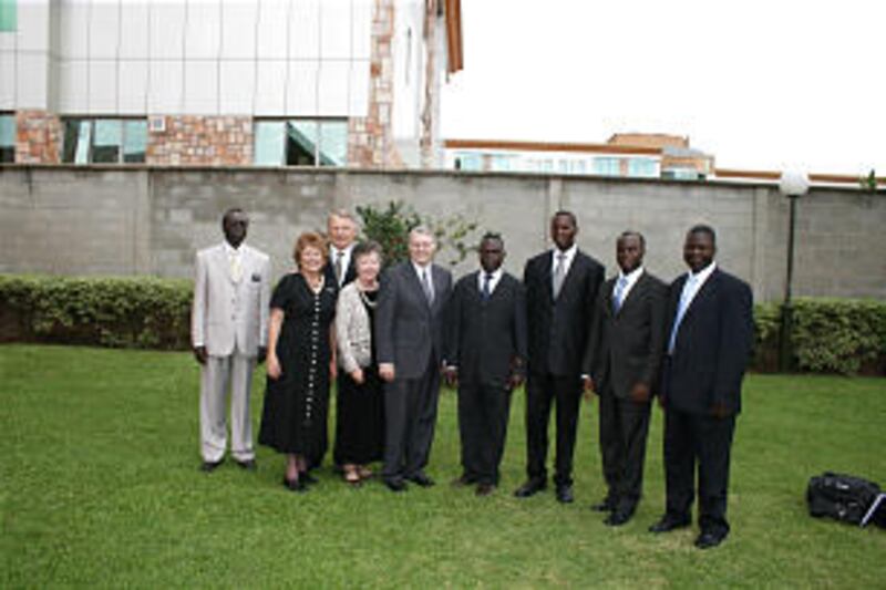 Leaders at conference, from left, Giles Odongo, stake patriarch; Sister Erin Christensen, President