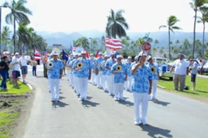 Community members in October 2003 parade in Laie mark the 40th anniversary of the Polynesian Cultura