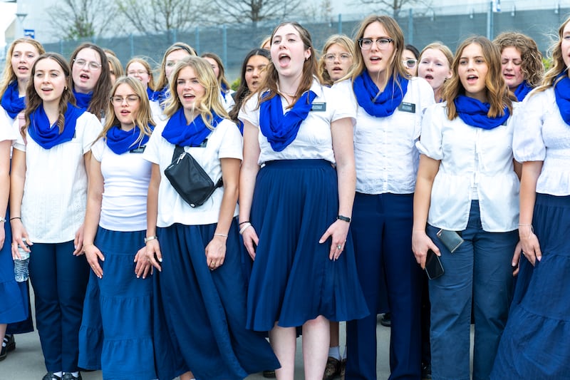 Sister missionaries in the Missouri Independence Mission warm up before singing the national anthem at the Kansas City Royals game, Thursday, April 9, 2026.