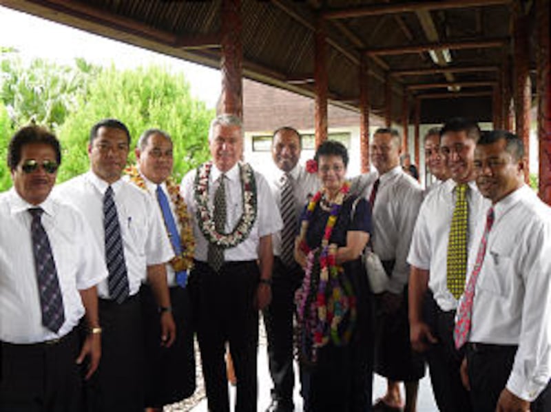 President Dieter F. Uchtdorf and Sister Harriet Uchtdorf are welcomed by a group of priesthood holde