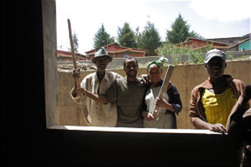 Abenet Eshetu, Fanose Yame and Belachew Dabe work on the Debre Zeit meetinghouse.