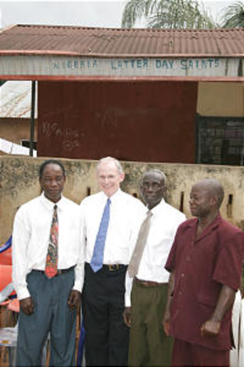 Ralph Mabey joins Raymond Obinna, right center, Francis, left, and Albert Obinna under original sign