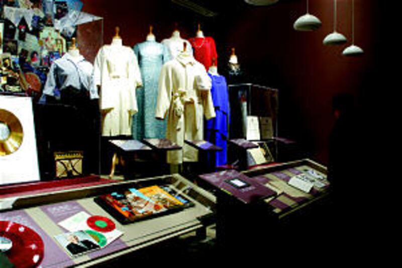 Above, dresses from differing periods of time, including one from the inauguration of President Lynd
